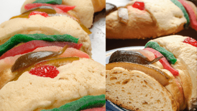 Detailed view of Rosca de Reyes sections, showcasing its soft bread texture and vibrant candied fruits on top.